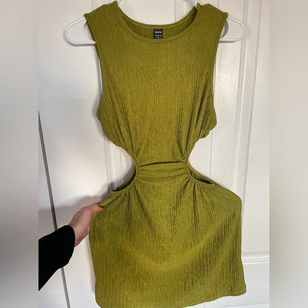Women’s size small green side cut out dress. Great condition